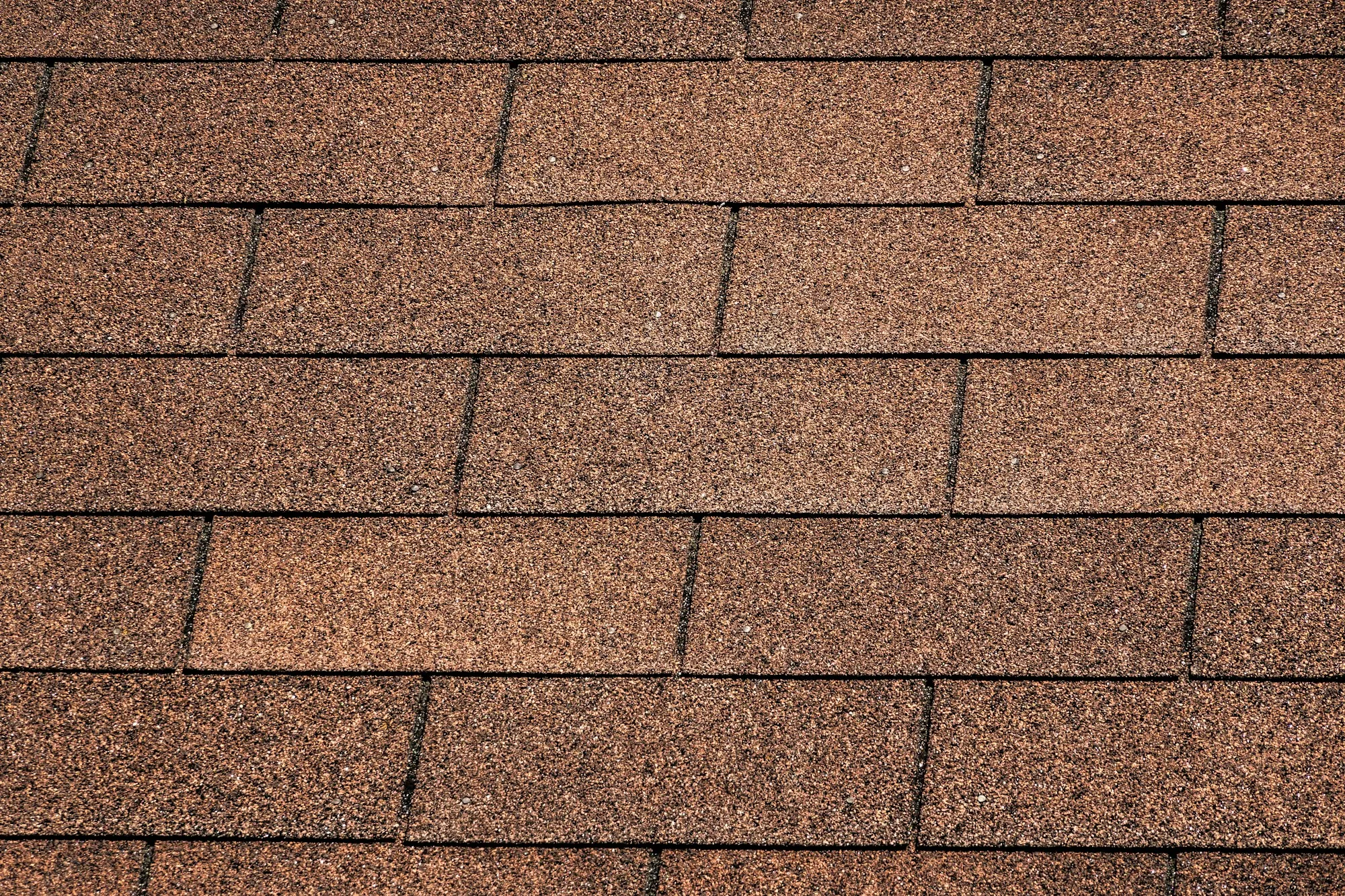 Close-up of brown three-tab asphalt shingles